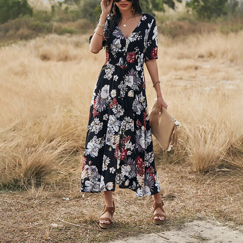 Women's floral print summer dress with V-neck, elastic waist, and large hemline skirt in yellow colour