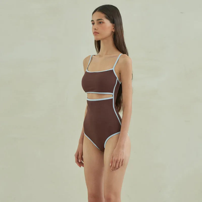 Brown women's one-piece swimsuit with triangle neckline on mannequin