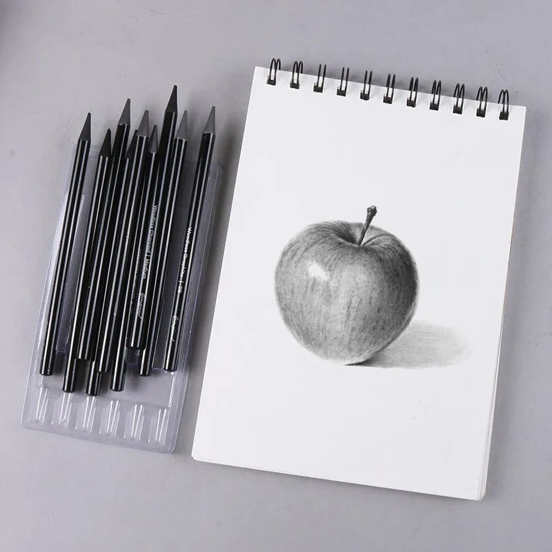 Set of nine wooden drawing pencils on a card, including graphite and carbonized pencils for sketching.