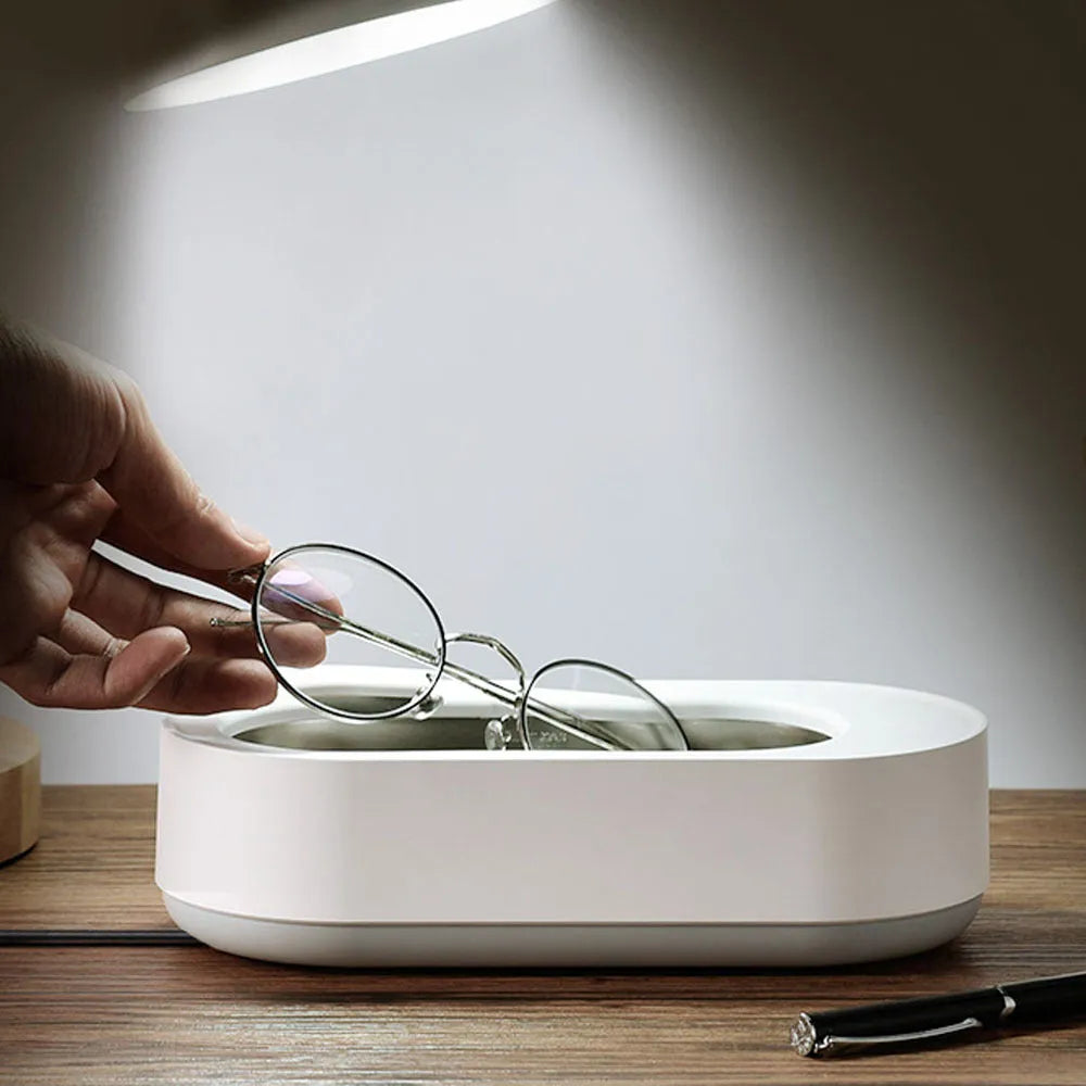 White portable ultrasonic cleaning machine with stainless steel tank and touch button.