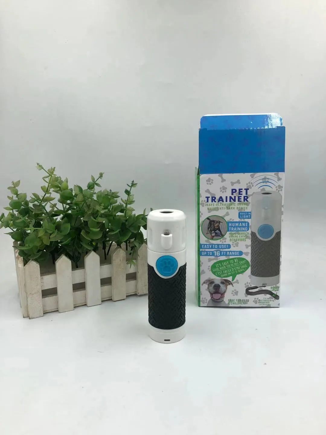 White handheld ultrasonic dog trainer device for barking control and behaviour correction
