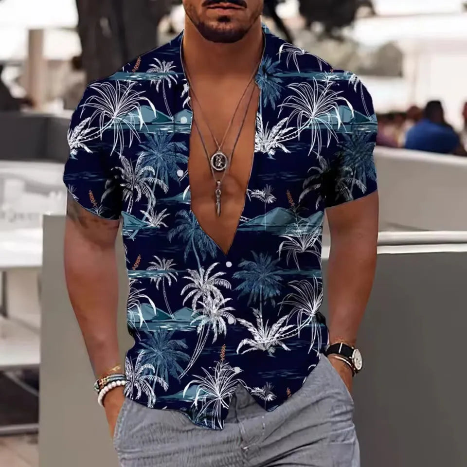 Man wearing a loose-fitting short-sleeve shirt with a colourful floral print pattern.