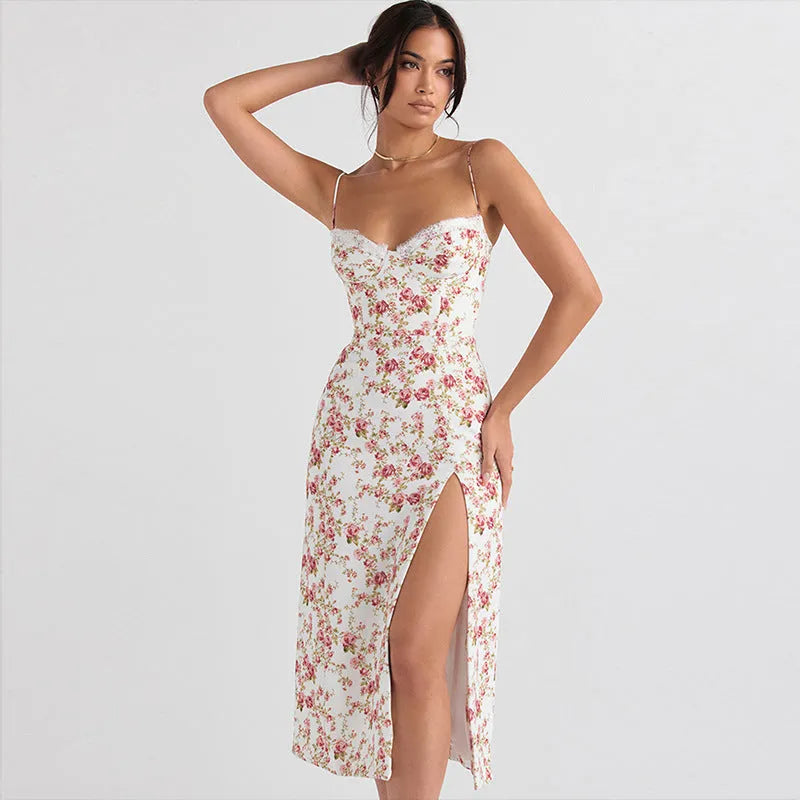 Women's blue lace flower print long dress with suspender neckline and side slit.