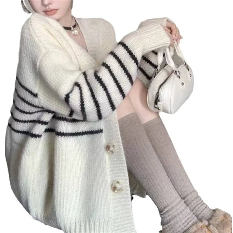 Collar button cardigan in pictured colour with 3D effect polyester fabric.
