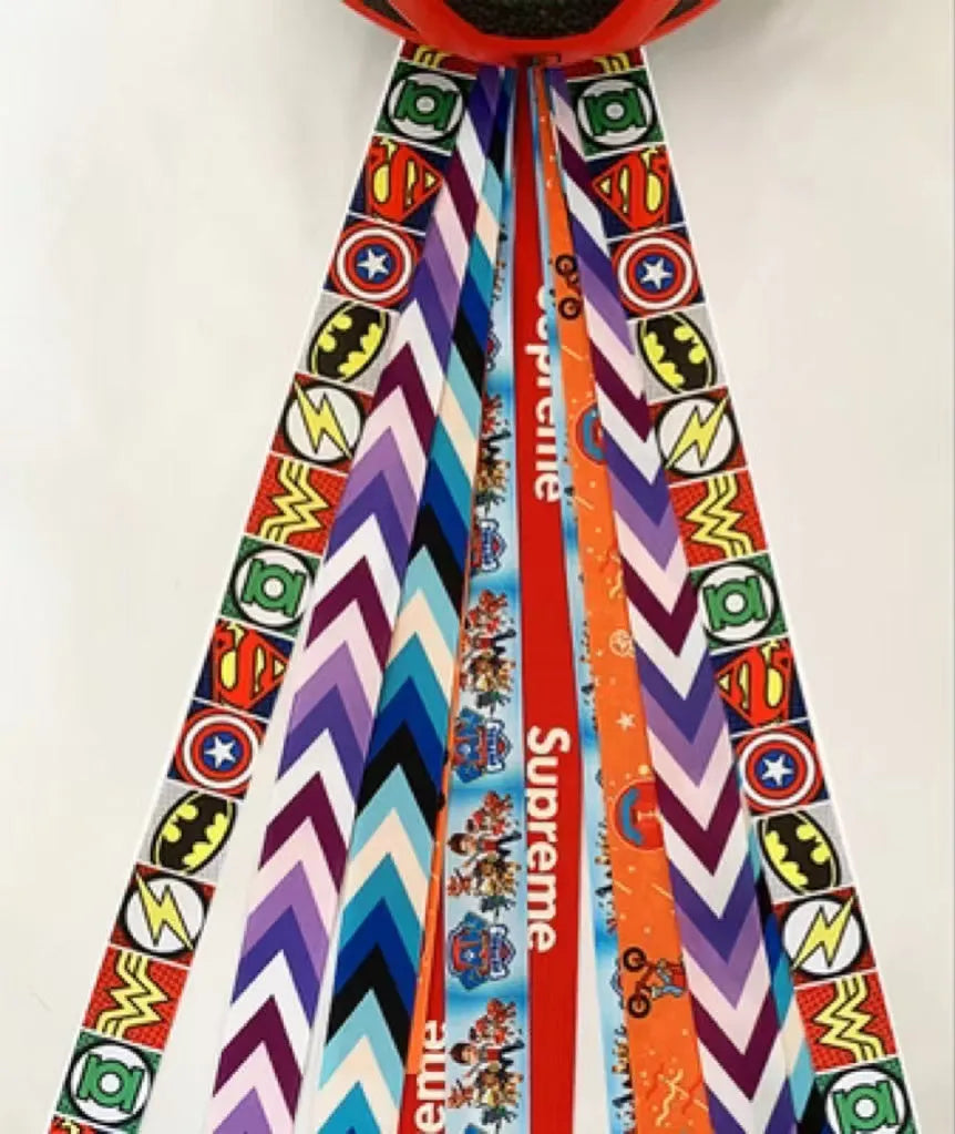 Children's decorative helmet streamer ribbon in multiple colours for roller skating and skiing safety gear.