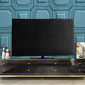 Pink velvet fabric cover draped over a large flat-screen television.
