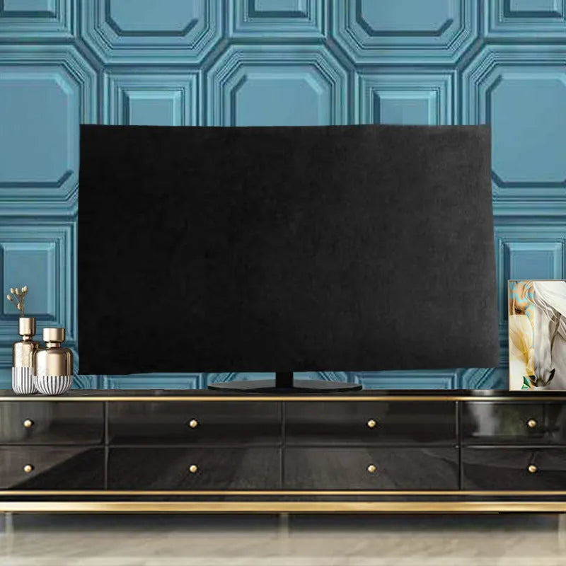 Pink velvet fabric cover draped over a large flat-screen television.