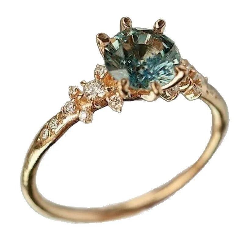 Gold-plated ring with geometric chamfered pattern and claw-set zircon stone