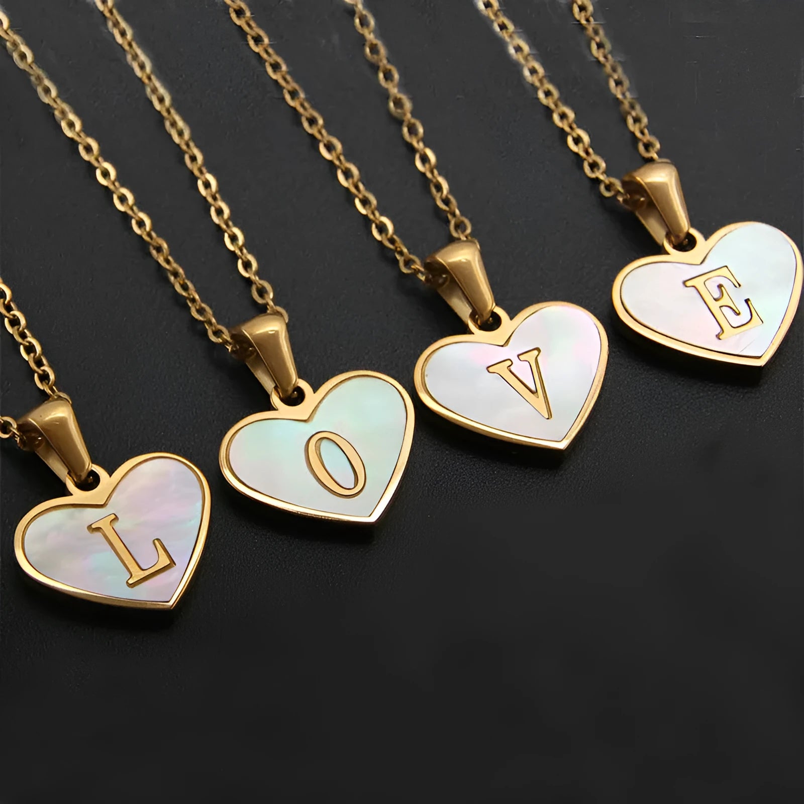 Gold plated heart-shaped necklace with white shell pendant on adjustable stainless steel chain
