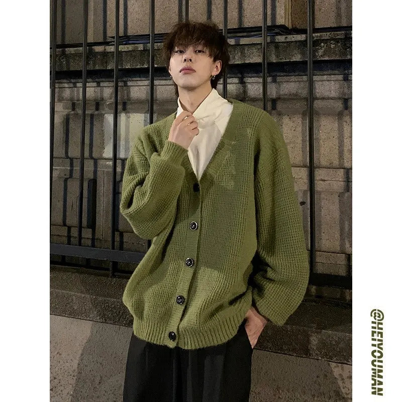 Men's loose-fit V-neck cotton blend cardigan sweater in army green, shown on a hanger.