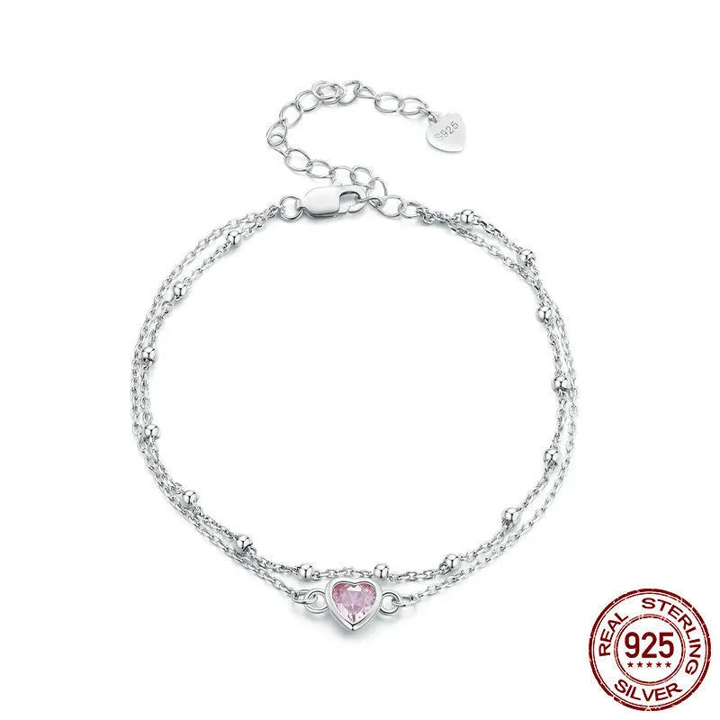 Women's 925 sterling silver bracelet with a small heart charm on an adjustable chain.