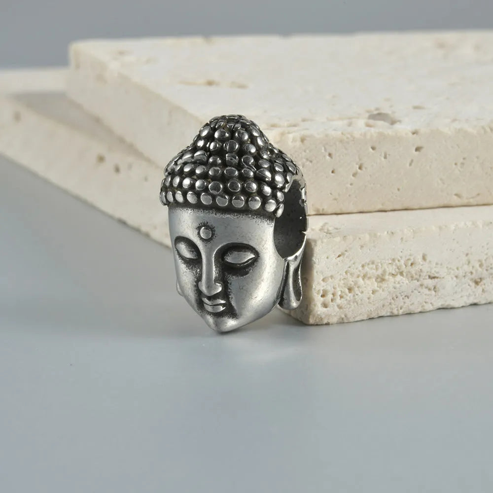 Stainless steel hollow geometric skull Buddha earrings for auricle piercing in electroplated colours