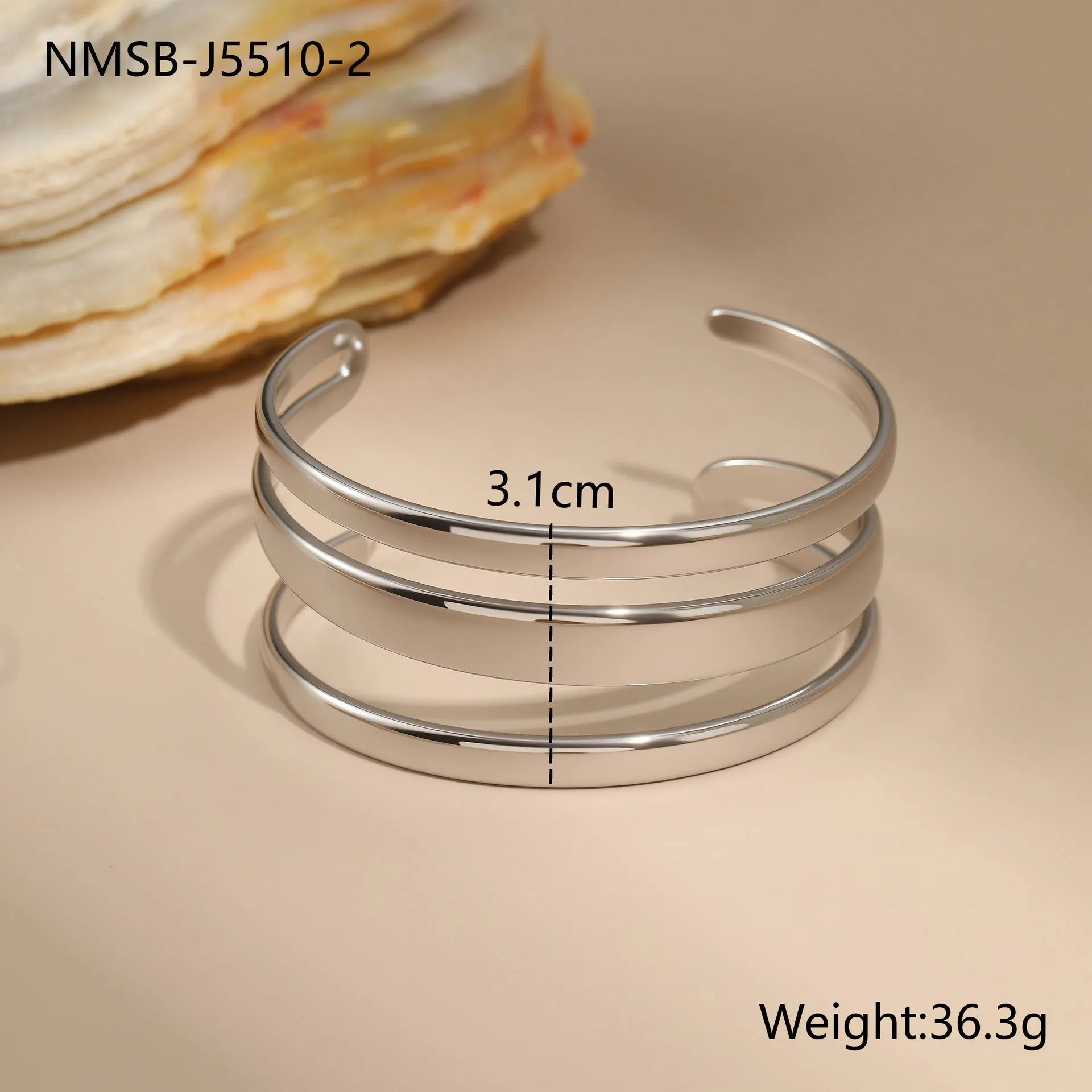 A geometric line design stainless steel bracelet with a simple opening clasp, shown in a gold electroplated finish.