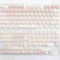Complete set of PBT sublimation printed keycaps for mechanical keyboards arranged in grid pattern