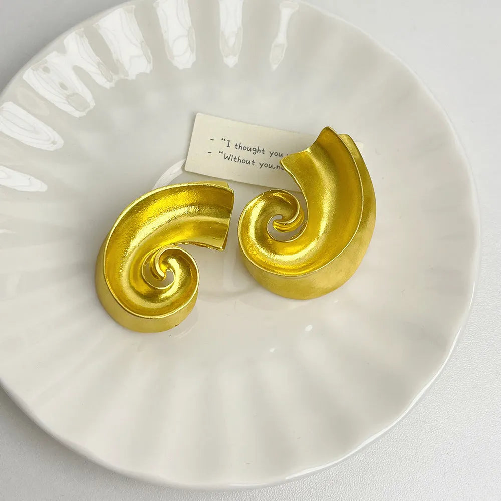 Geometric retro ear studs in gold and silver electroplated alloy, approximately 5cm size with stud fastening