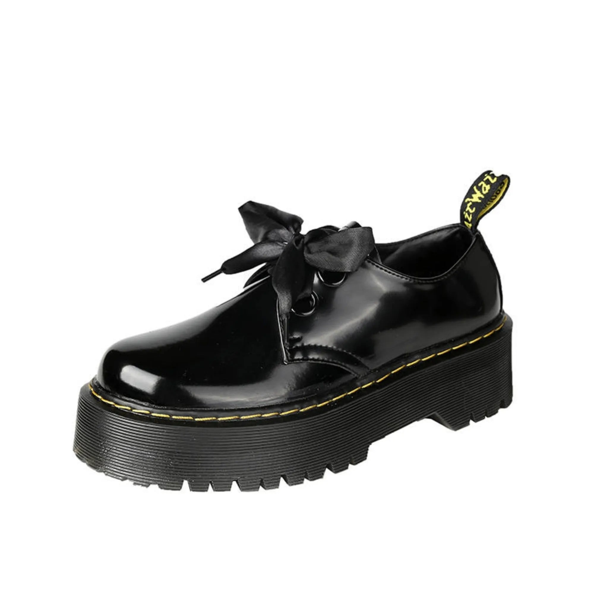 Women's black leather shoes with thick soles, ribbon cross-straps, and lace closure