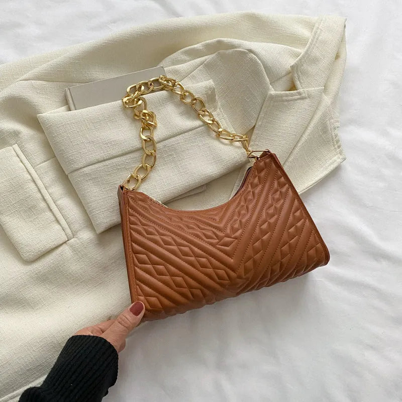 Brown pleated chain baguette shoulder bag showing vertical square shape and adjustable 50cm strap