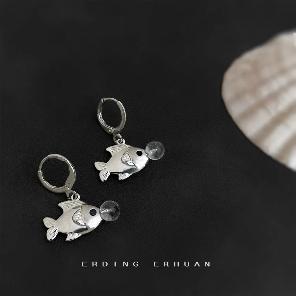 A pair of copper bubble fish earrings with goldfish elements and an electroplated finish.