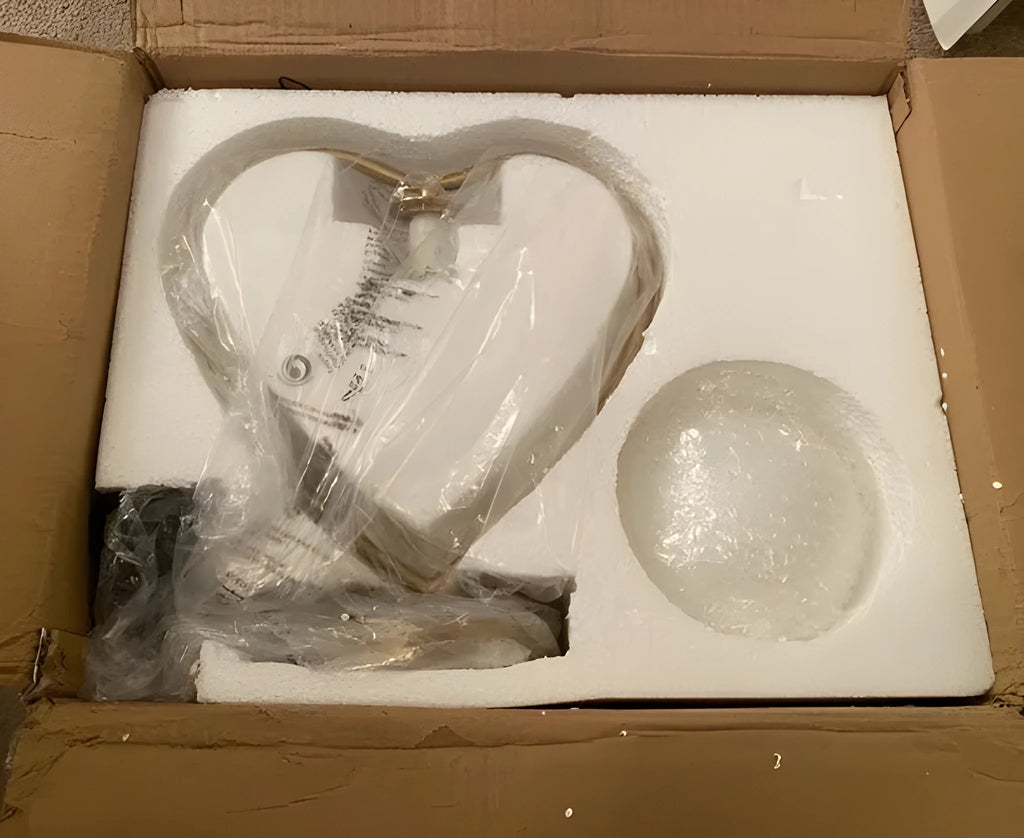 White heart shaped LED lamp with warm glow, shown on a surface