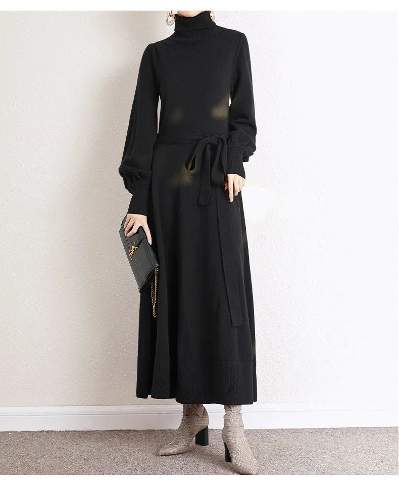 A rose red loose-fit turtleneck knit dress for women with long sleeves and a mid-length flared skirt.