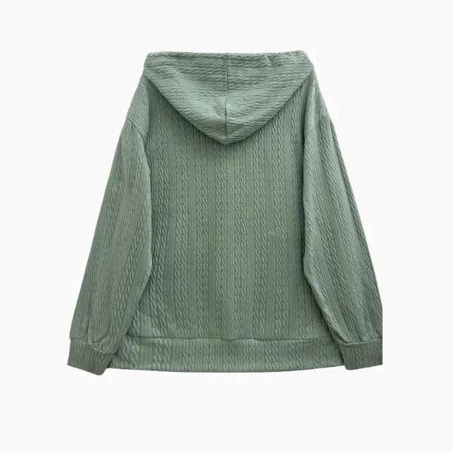 Green women's hooded zipper sweater jacket laid flat, showing casual loose fit and long sleeves.