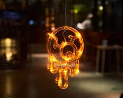 Halloween window hanging LED lights with seven designs including spider, pumpkin, ghost, and bat motifs
