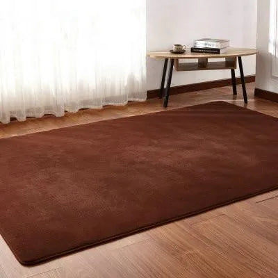 Solid colour fluffy plush rectangle carpet showing soft pile and non-slip dotted bottom.