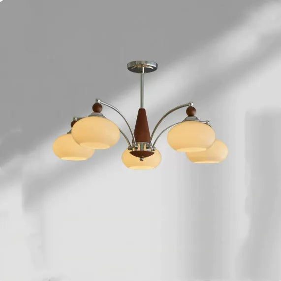 Traditional persimmon glass and chrome chandelier with multiple light heads for a dining room.