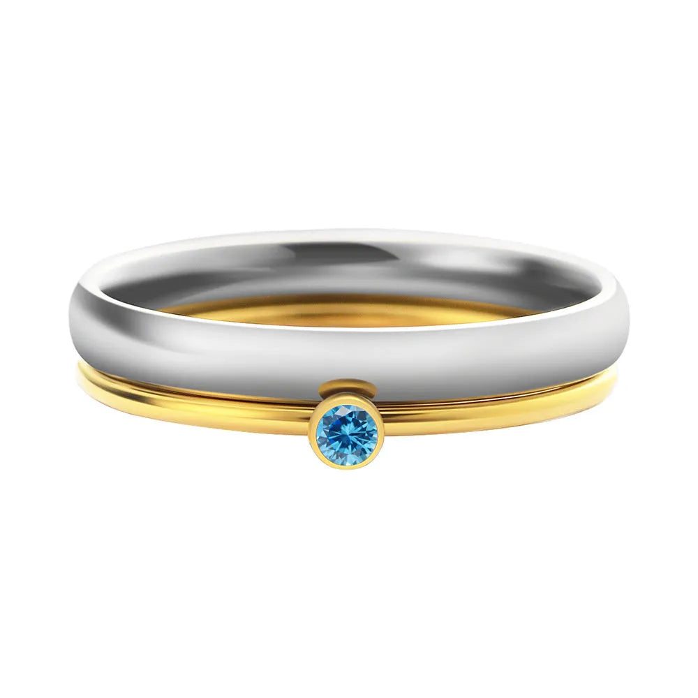Close-up of a geometric titanium steel women's ring with a December birthstone and engraved pattern.
