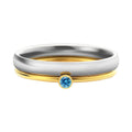 Close-up of a geometric titanium steel women's ring with a December birthstone and engraved pattern.