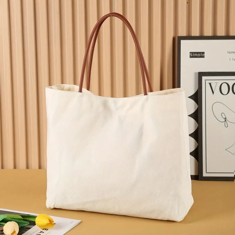 Canvas tote bag in cotton fabric with reinforced stitching, shown in beige white and white colour options