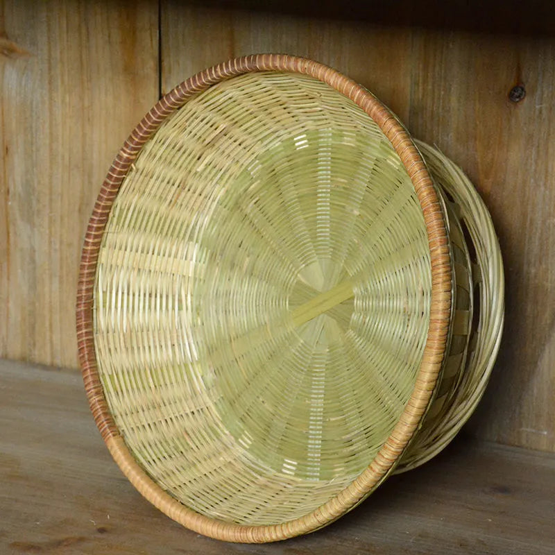Handmade woven bamboo storage basket in natural colour showing traditional craftsmanship