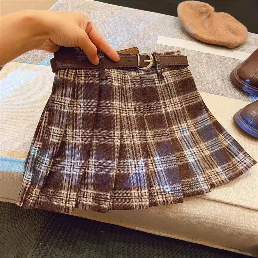Girls' plaid pleated A-line skirt made from cotton blend fabric with a full lining.