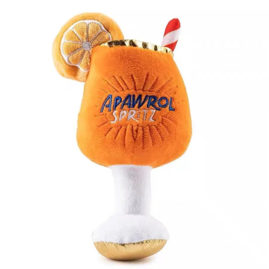 Yellow beer bottle shaped plush squeaky dog toy with cup handle on a white background.
