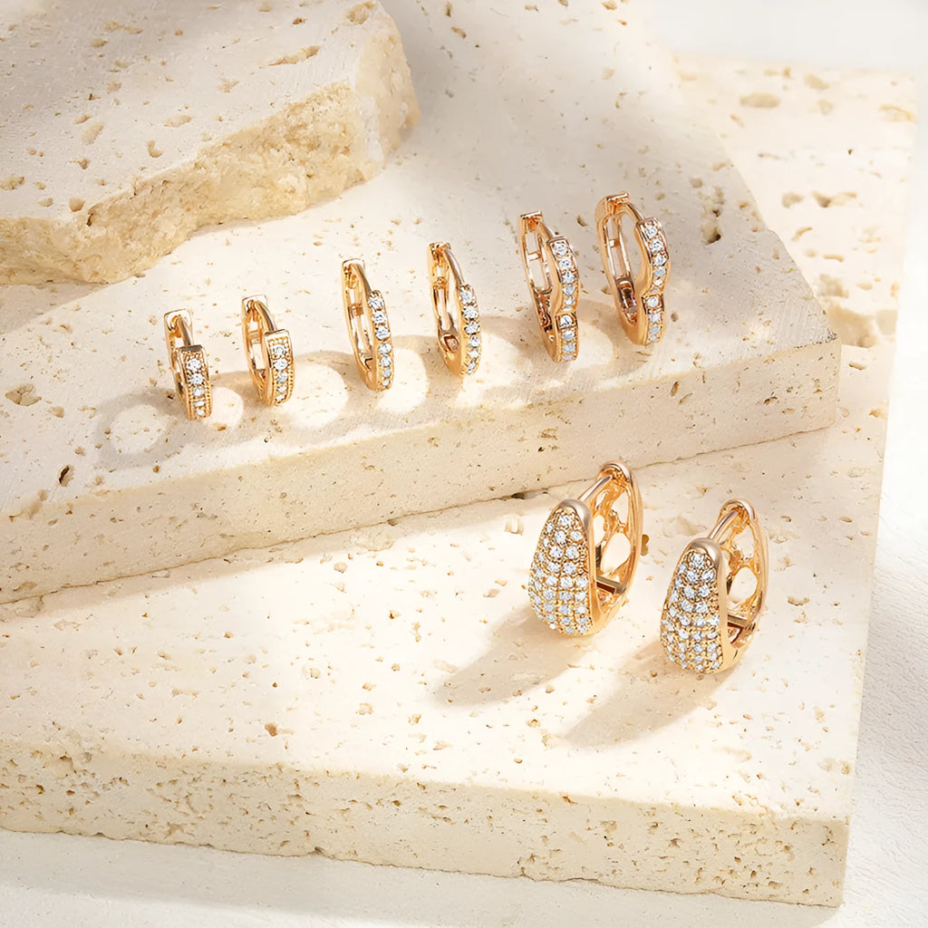 Gold plated heart-shaped clip earrings with zircon stones and gang drill decorative elements