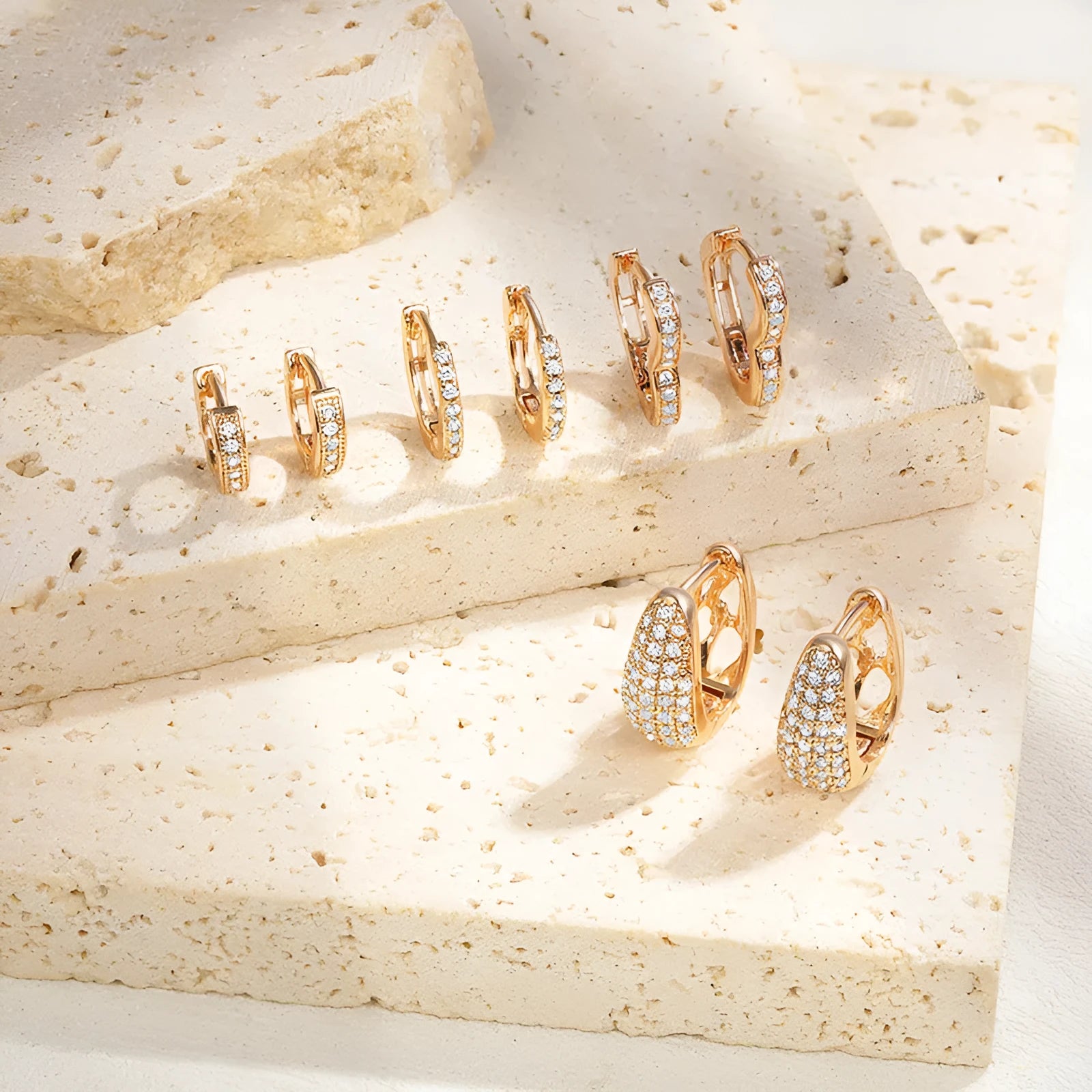Gold plated heart-shaped clip earrings with zircon stones and gang drill decorative elements