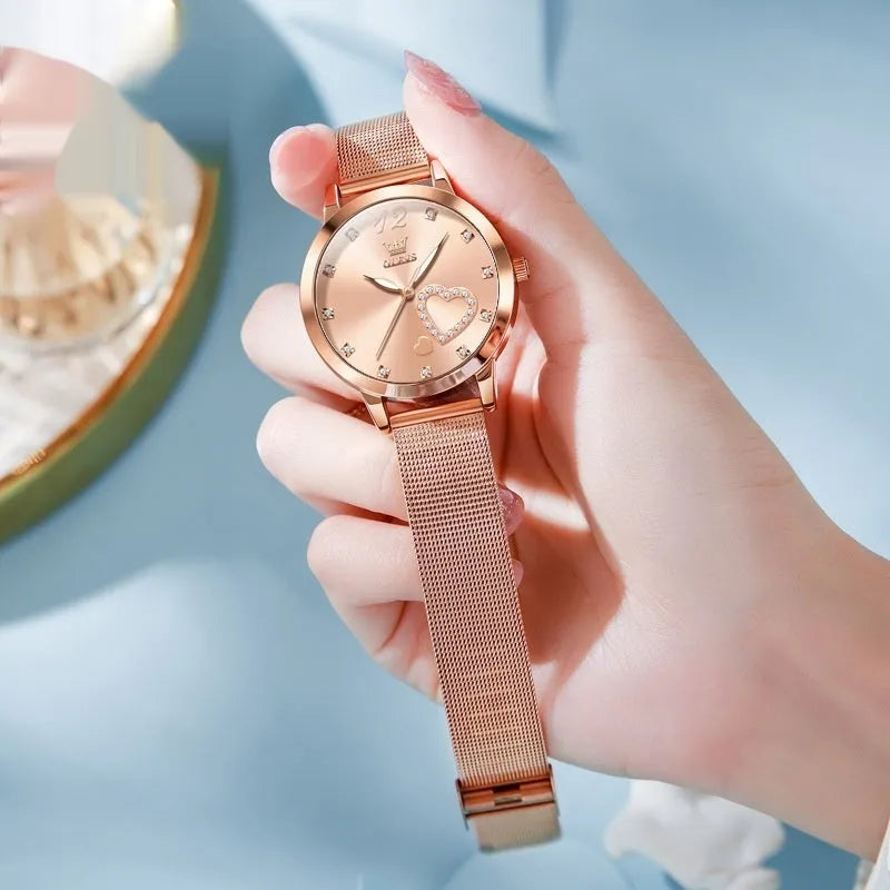 Women's fashion watch with rose gold mesh strap showing six dial colour options: white, black, blue, red, pink, green.