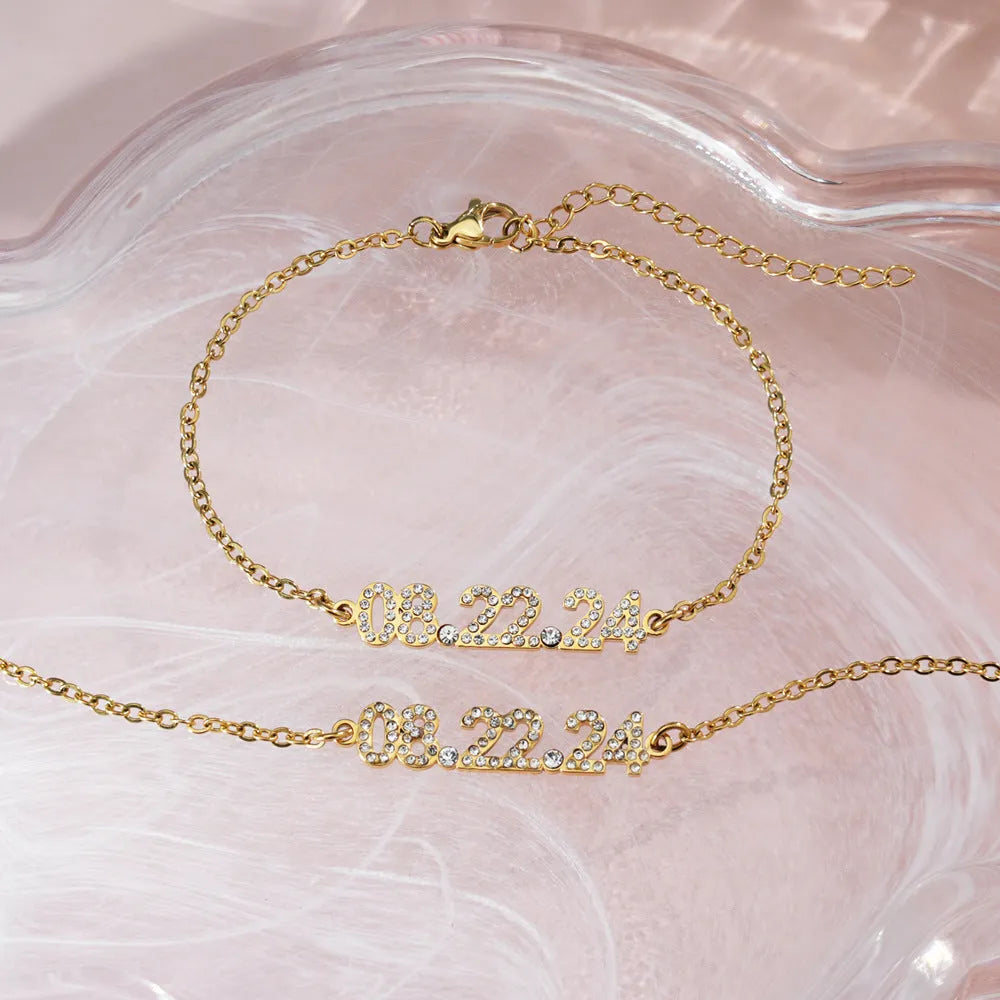 Stainless steel digital bracelet with diamond studs around LED display, shown in gold colour