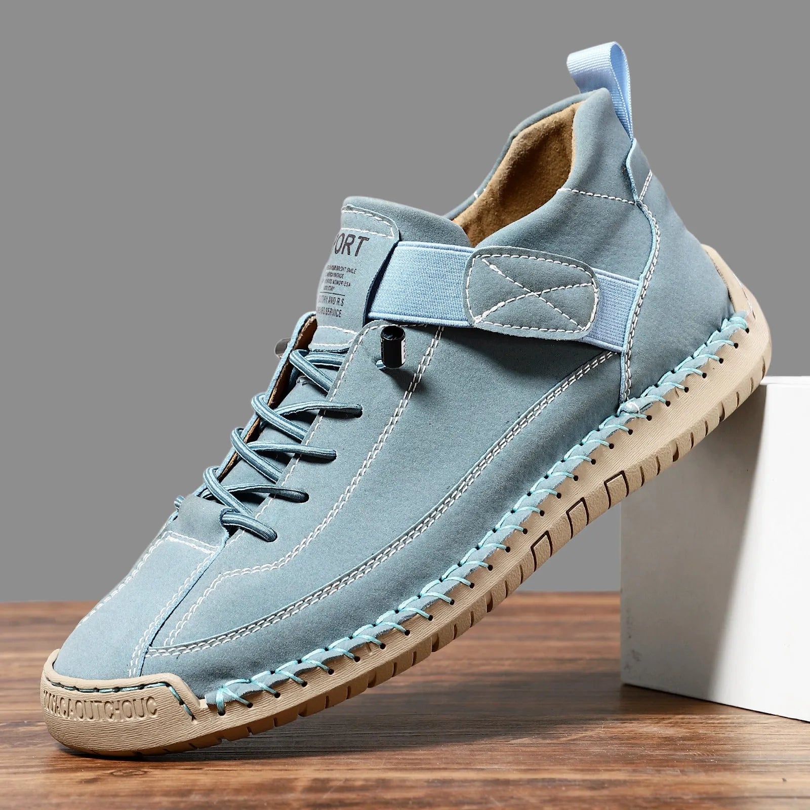 Men's mid-top Martin boot in a solid colour with elastic band and round toe.