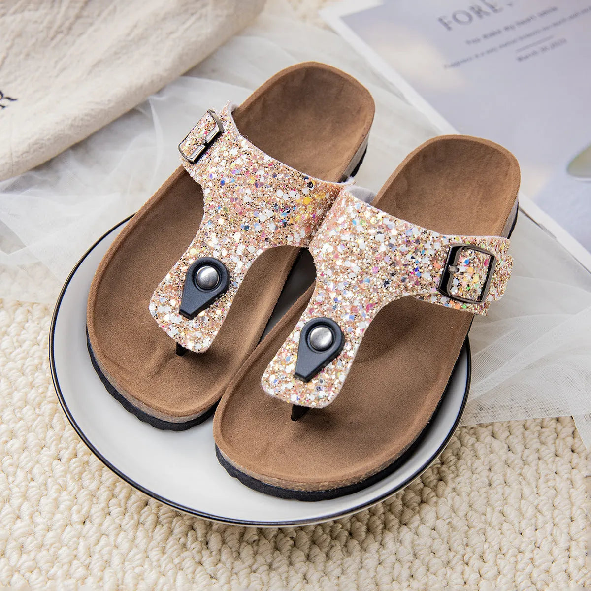 Gold frosted cork flip-flop slippers with hollow-out design and non-slip PVC sole.