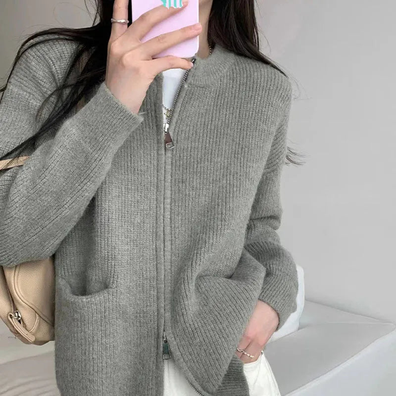 Beige viscose women's sweater coat cardigan with long sleeves laid flat.
