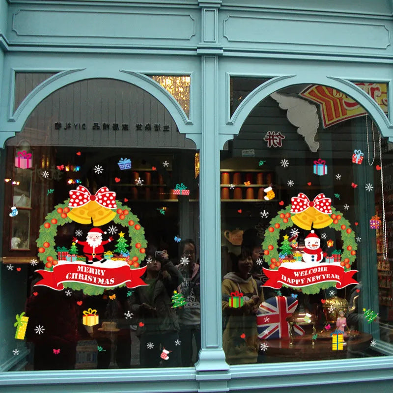 Two large colourful cartoon Christmas static cling stickers on a glass window.