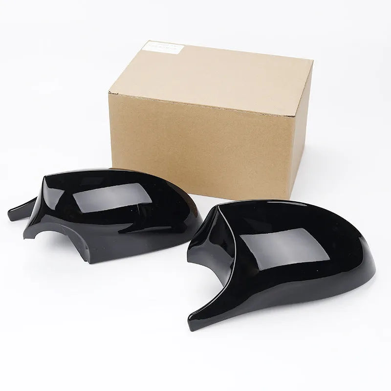 Pair of black and carbon pattern ABS plastic rearview mirror shells for BMW 3 Series E90.