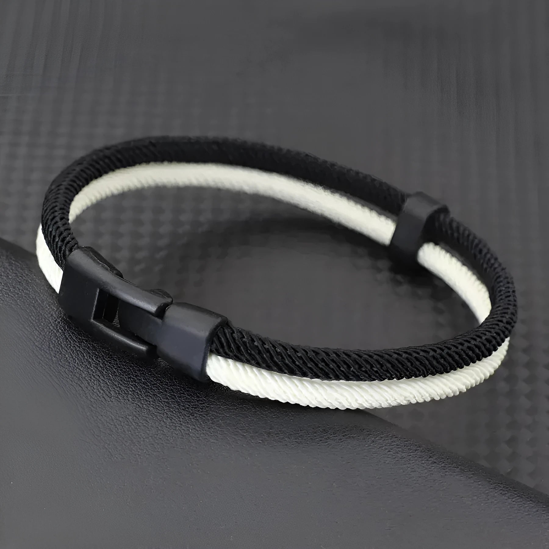 Handmade woven hand strap in black and white colour with alloy hardware