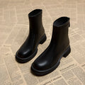 Women's flat heel ankle boots with back zipper in artificial PU, rounded toe design