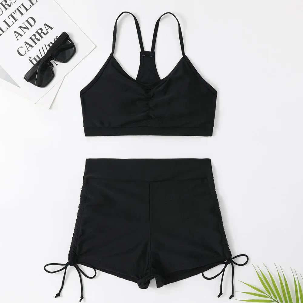Women's high waist split swimsuit bikini in black or purple colour with briefs styling
