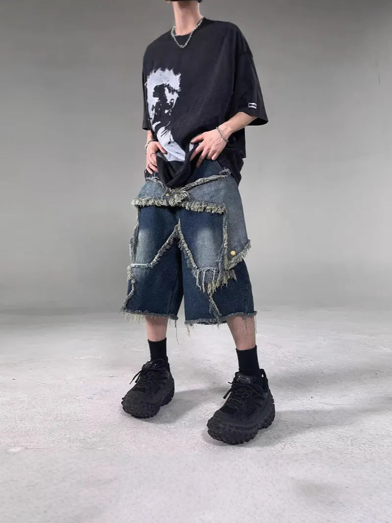 Blue denim shorts with five-pointed star detailing and frayed edges in loose fit style