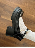 Beige and black women's Mary Jane shoes with a chunky round heel and round toe.